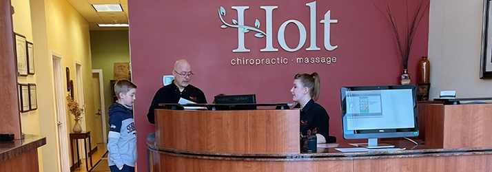 Chiropractor Port Orchard WA Tom Holt With Staff At Front Desk